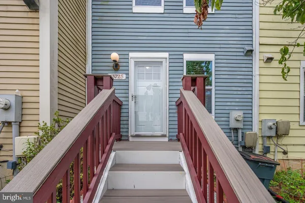 a view of a balcony with wooden floor and stairs