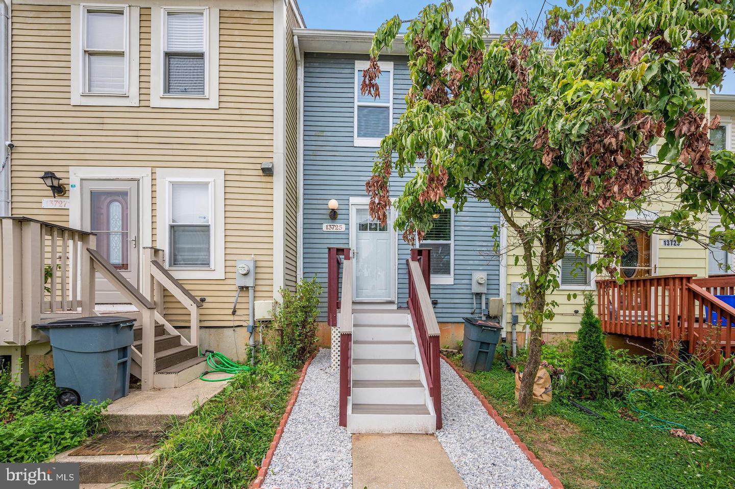 13725 Avonshire Drive Silver Spring, MD 20904 - Photo 25 of 26 a front view of a house with a garden and plants