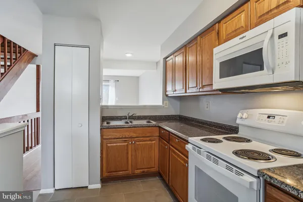 a kitchen with a stove and a microwave