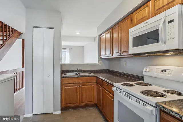 a kitchen with a stove and a microwave