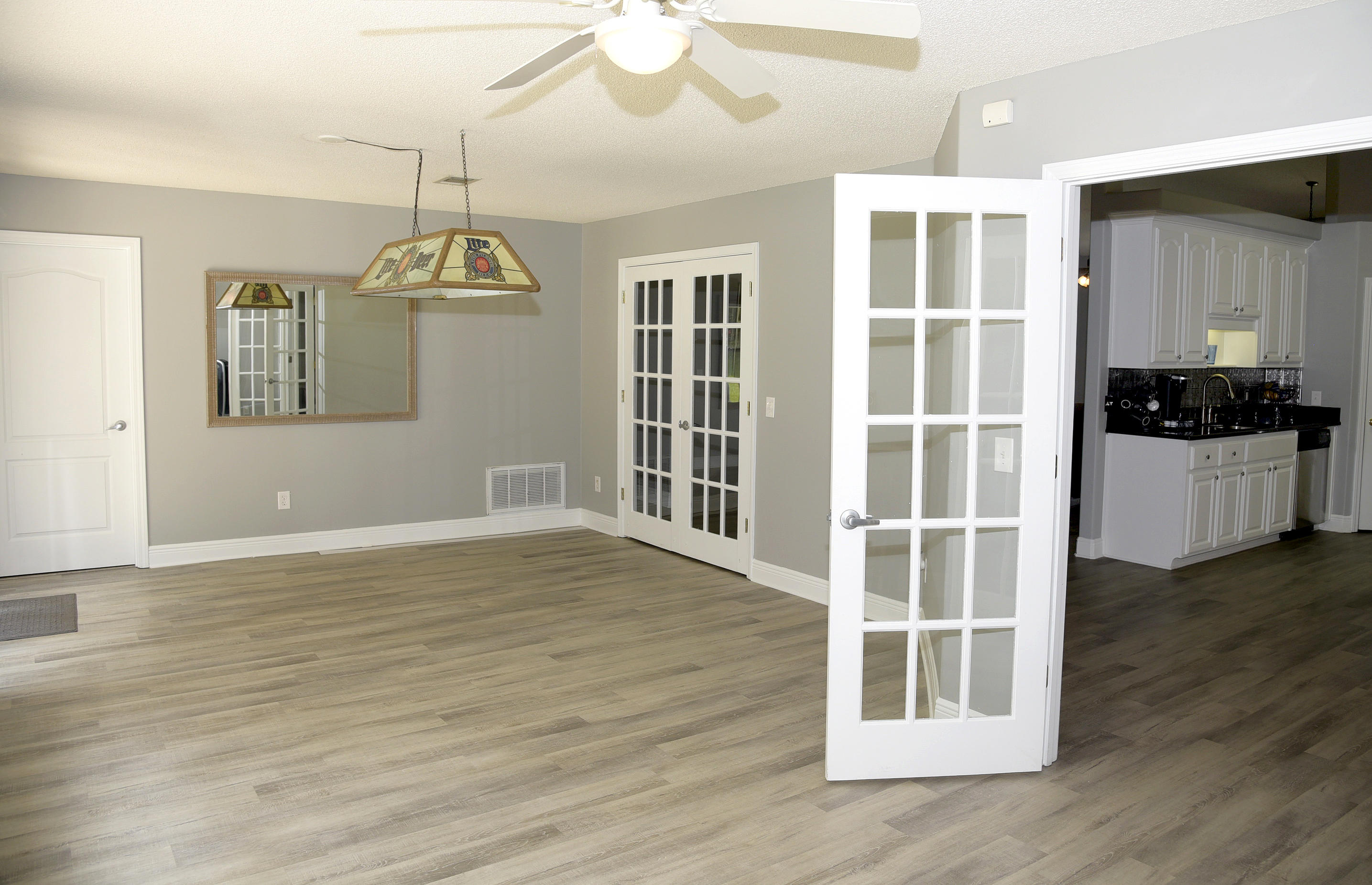 658 Territory Lane Crestview, FL 32536 - Photo 12 of 40 a view of a livingroom with wooden floor and a window