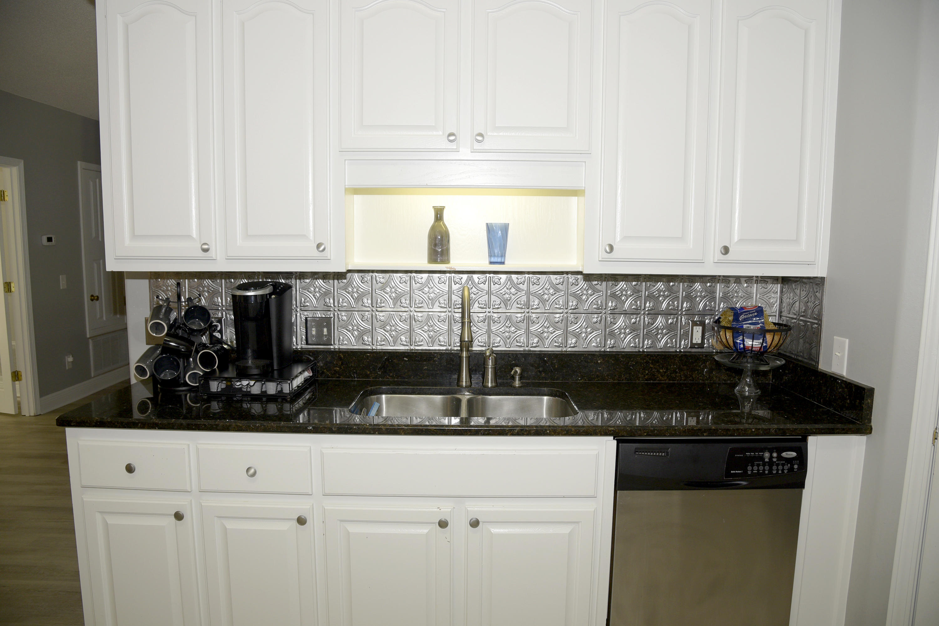 658 Territory Lane Crestview, FL 32536 - Photo 15 of 40 a kitchen with white cabinets and a stove