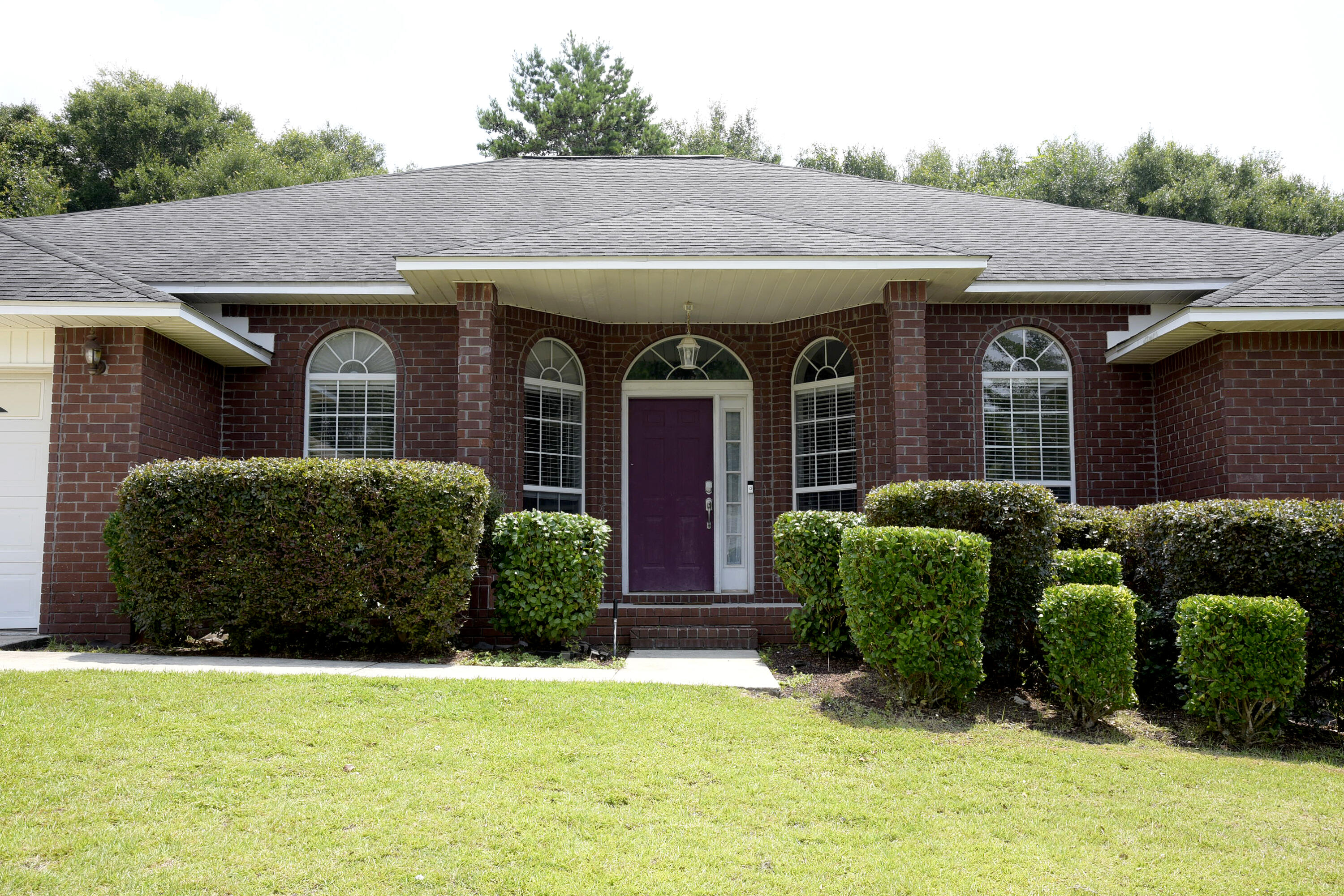 658 Territory Lane Crestview, FL 32536 - Photo 16 of 40 a front view of a house with garden