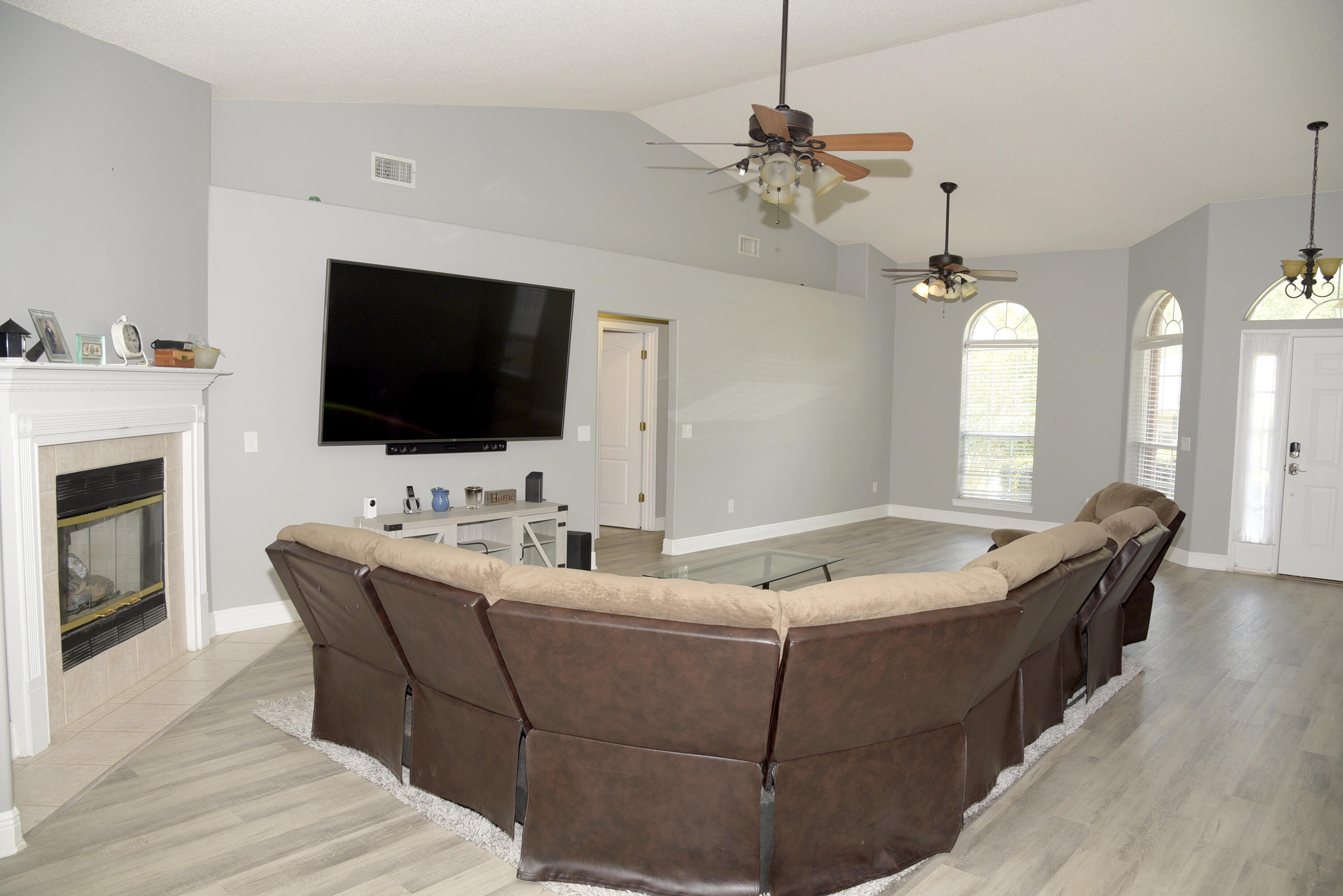 658 Territory Lane Crestview, FL 32536 - Photo 20 of 40 a living room with furniture and a flat screen tv