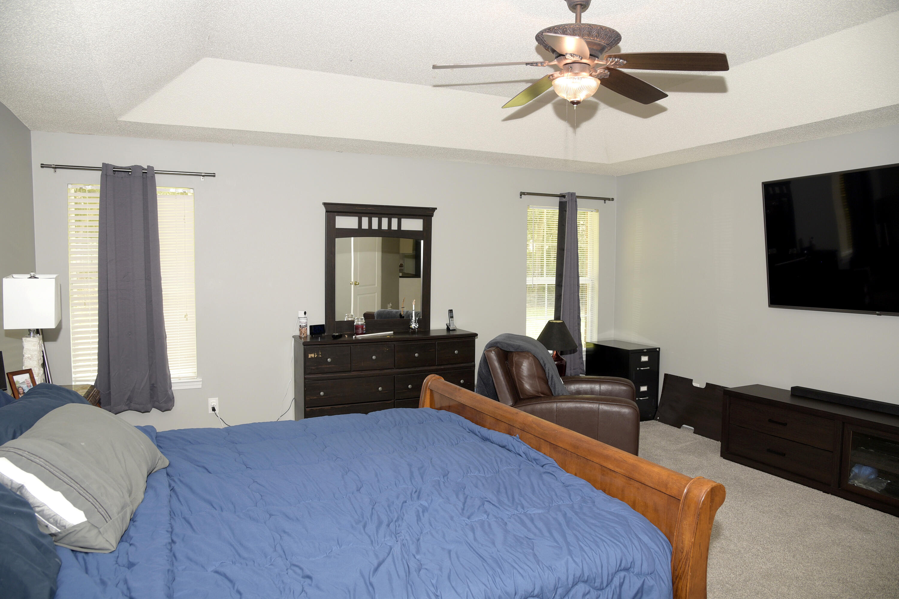 658 Territory Lane Crestview, FL 32536 - Photo 23 of 40 a bed room with a bed and a television