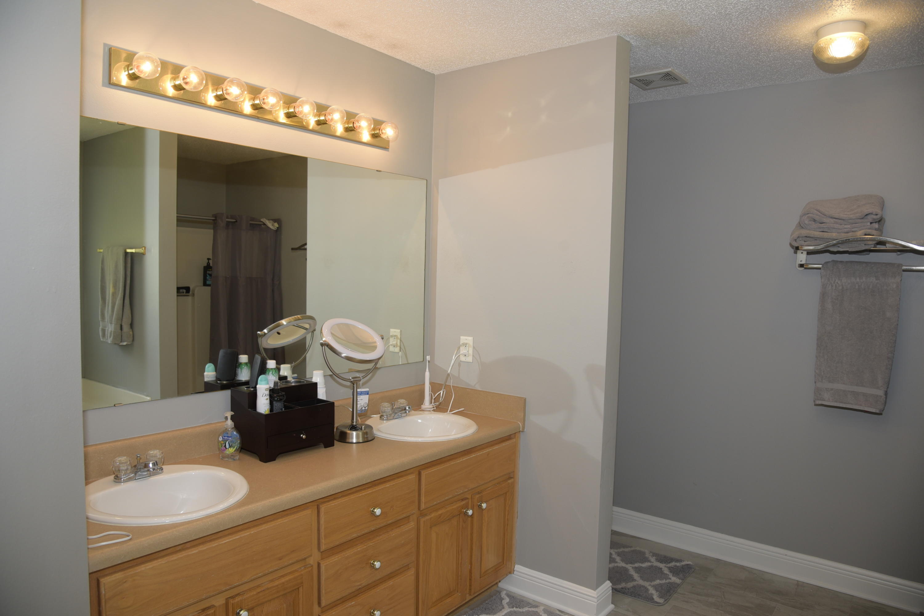 658 Territory Lane Crestview, FL 32536 - Photo 24 of 40 a bathroom with a sink and a mirror