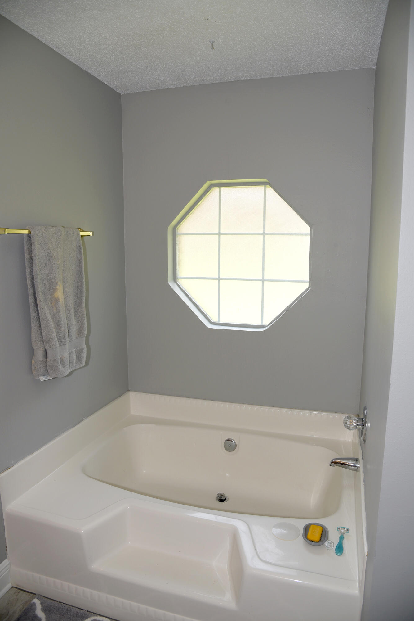 658 Territory Lane Crestview, FL 32536 - Photo 25 of 40 a bathroom with a bathtub and a window