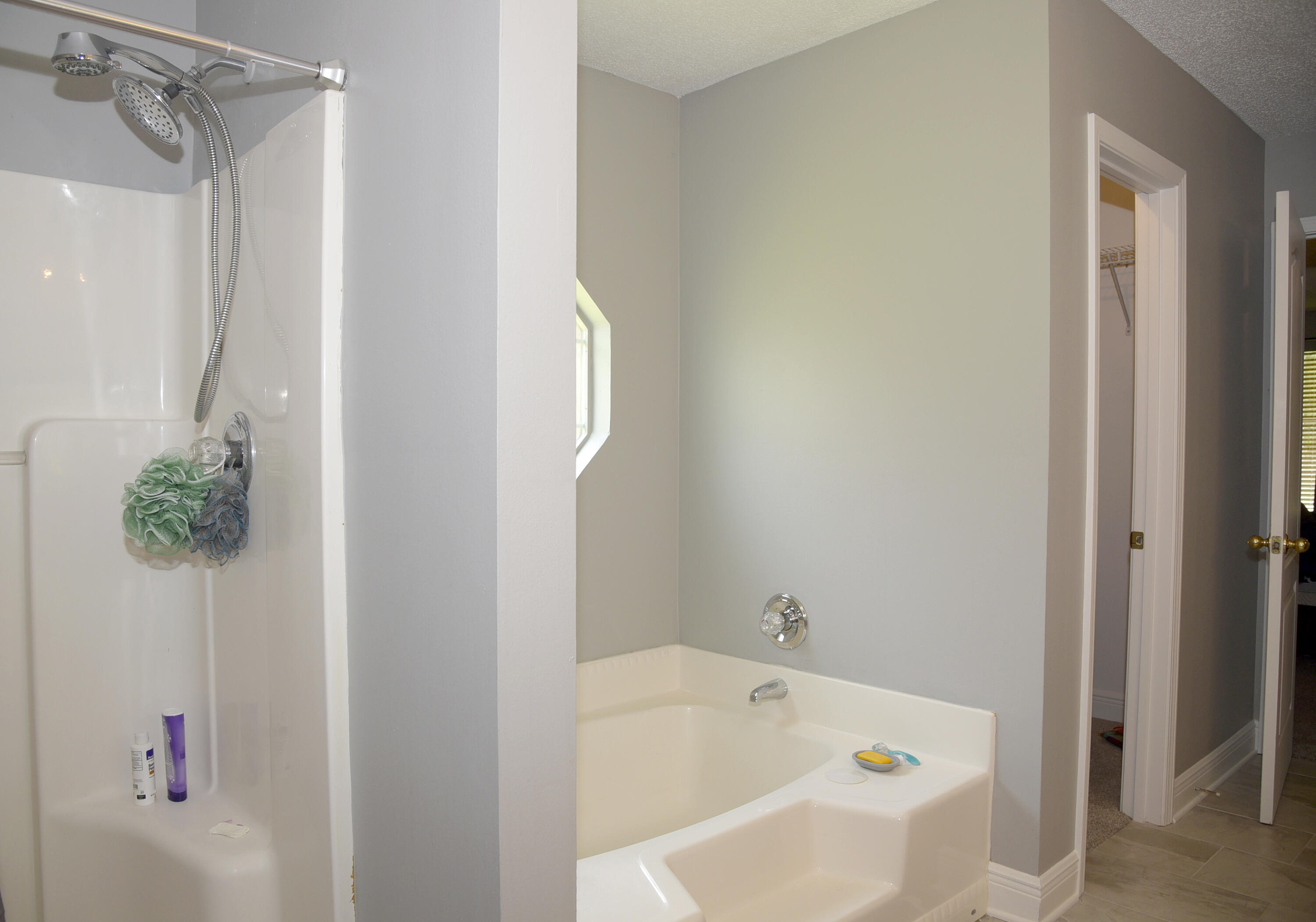 658 Territory Lane Crestview, FL 32536 - Photo 26 of 40 a bathroom with a bathtub and shower
