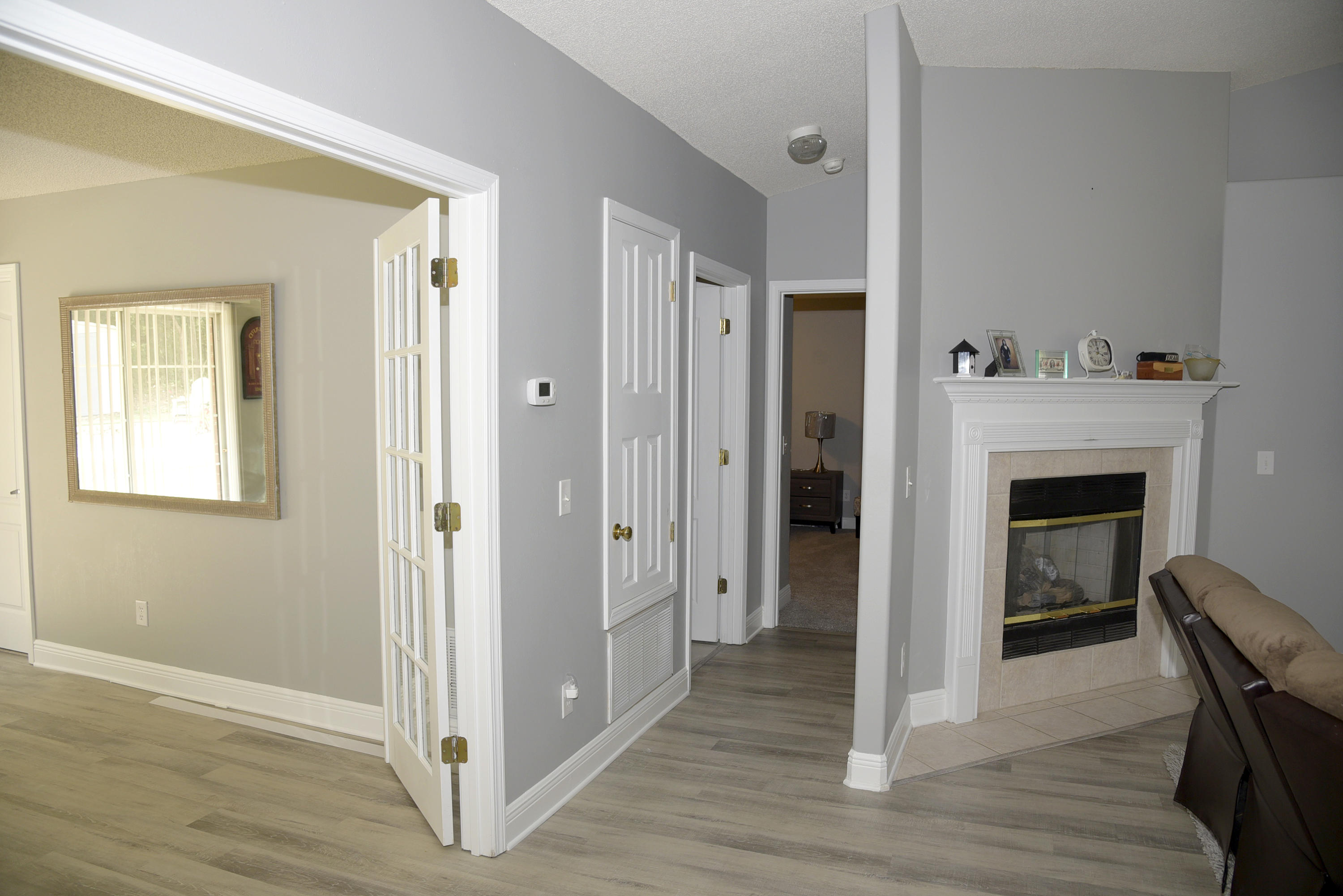 658 Territory Lane Crestview, FL 32536 - Photo 30 of 40 a view of a livingroom with wooden floor and a fireplace