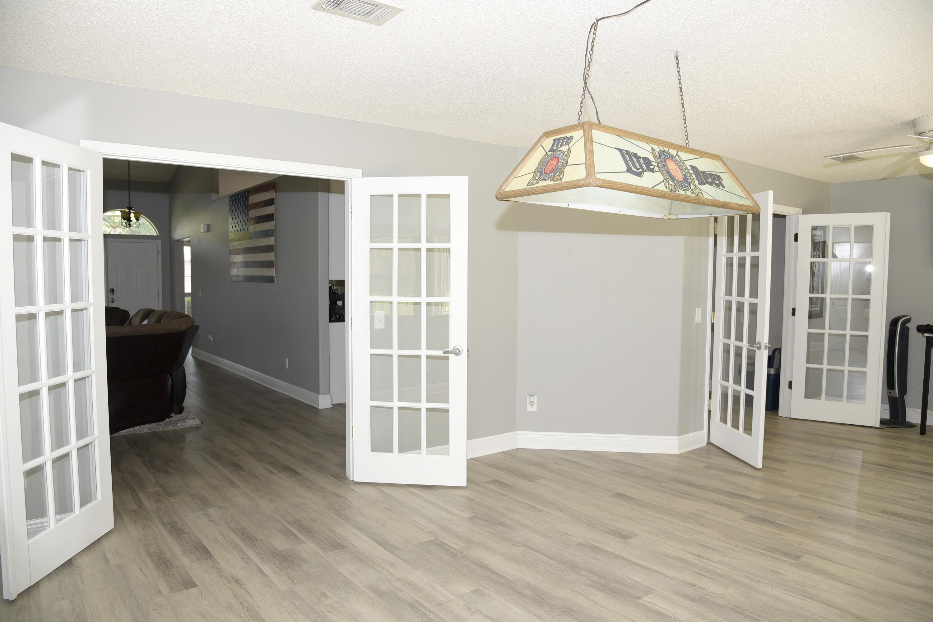 658 Territory Lane Crestview, FL 32536 - Photo 38 of 40 a view of a hallway with wooden floor and entryway