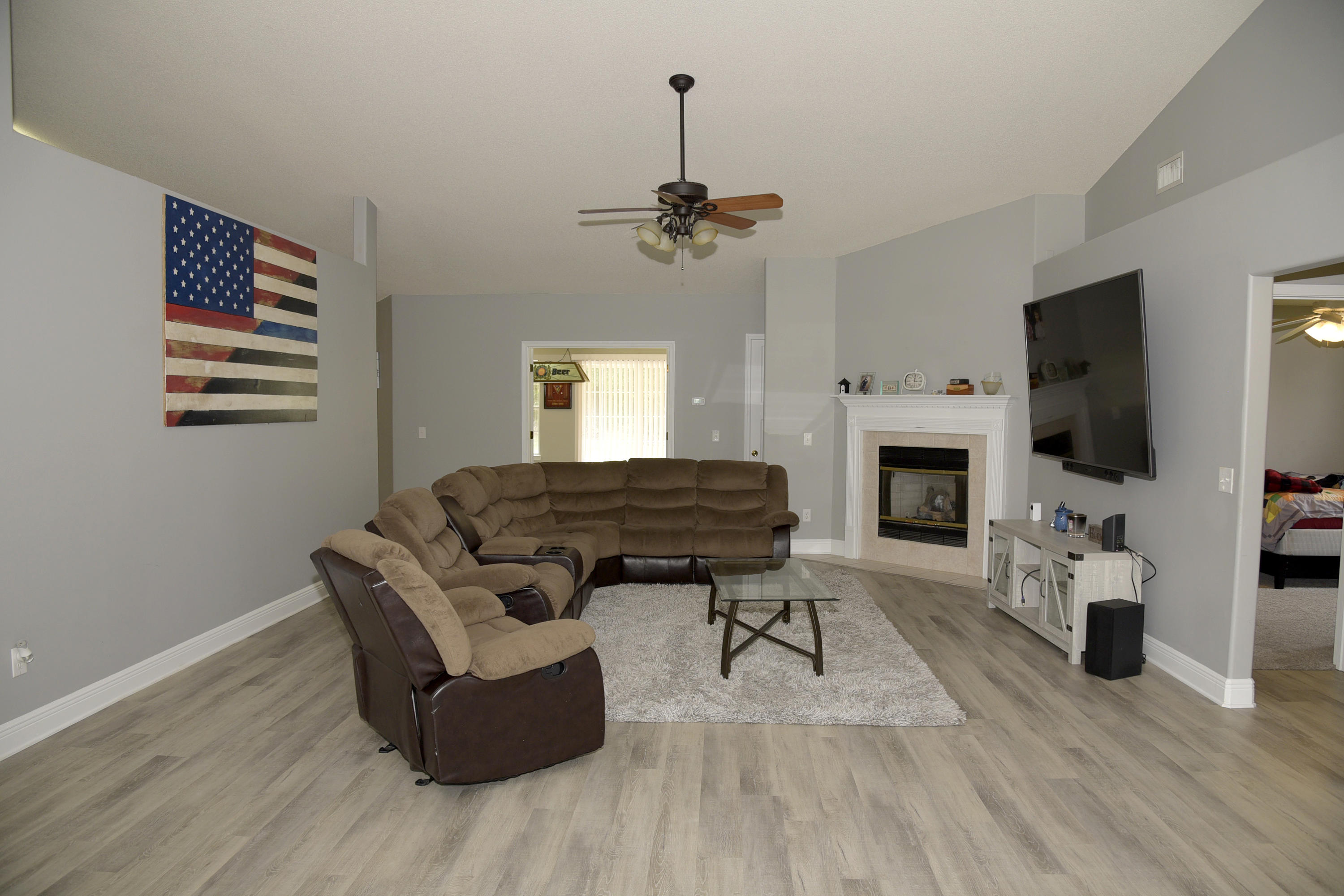 658 Territory Lane Crestview, FL 32536 - Photo 6 of 40 a living room with furniture fireplace and flat screen tv