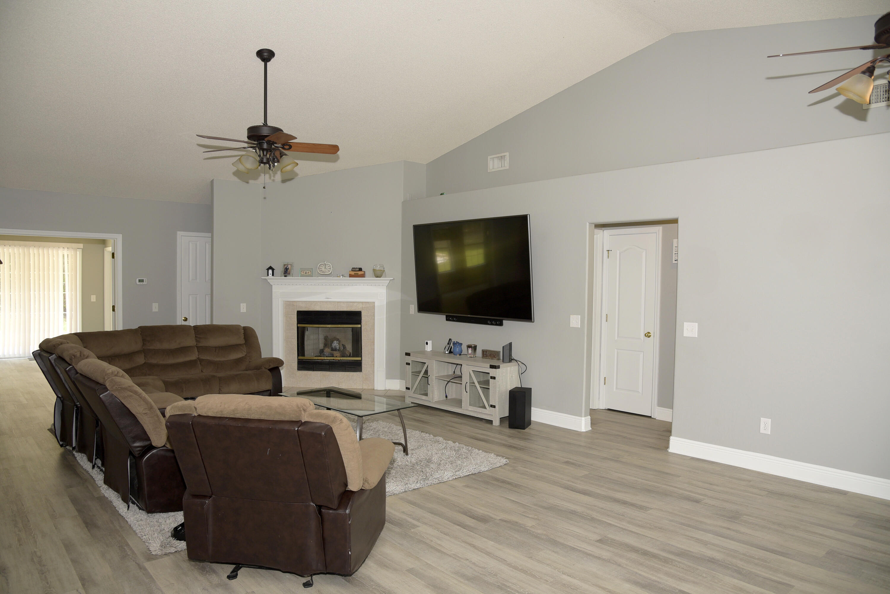 658 Territory Lane Crestview, FL 32536 - Photo 7 of 40 a living room with furniture fireplace and flat screen tv