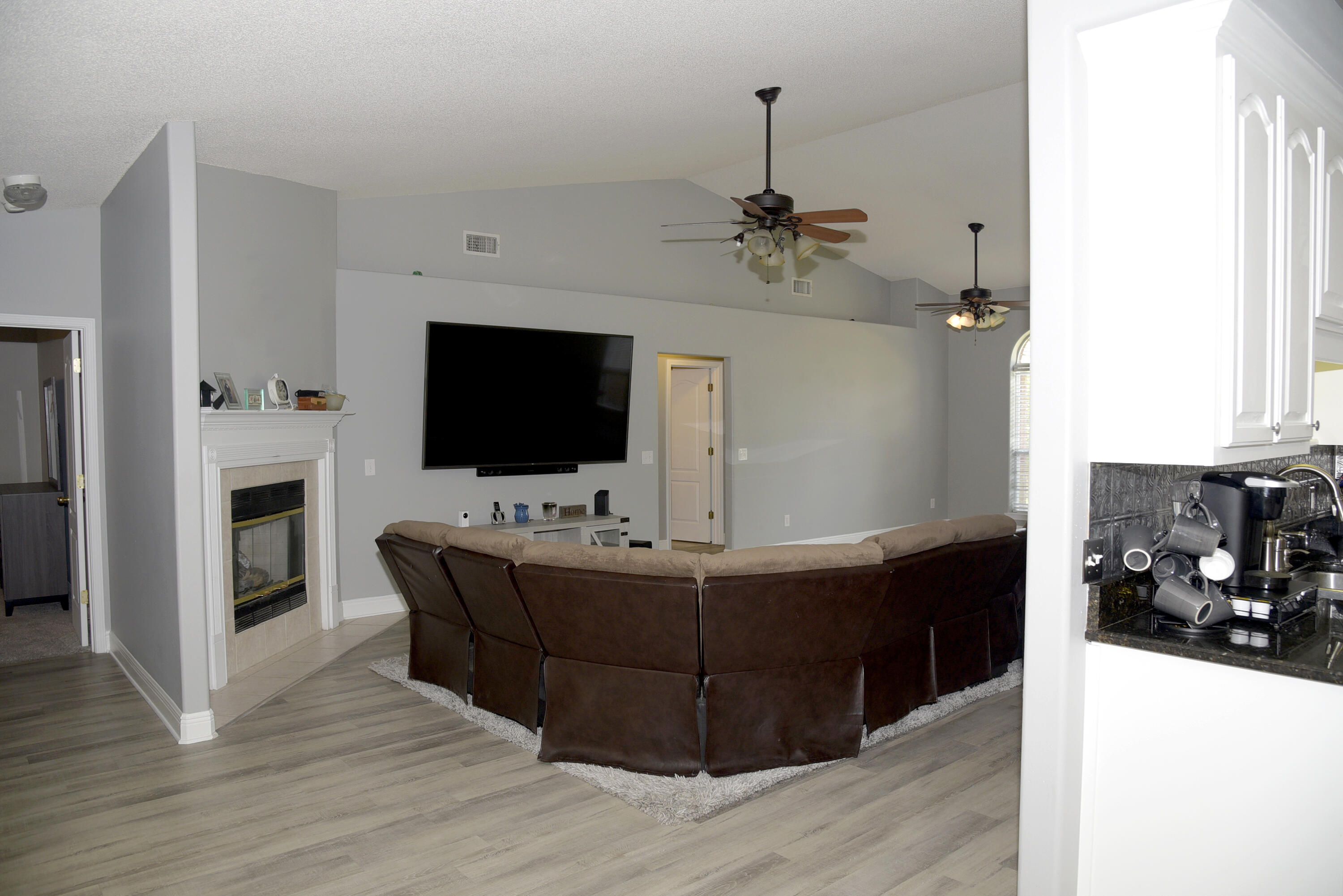 658 Territory Lane Crestview, FL 32536 - Photo 8 of 40 a living room with furniture and a flat screen tv
