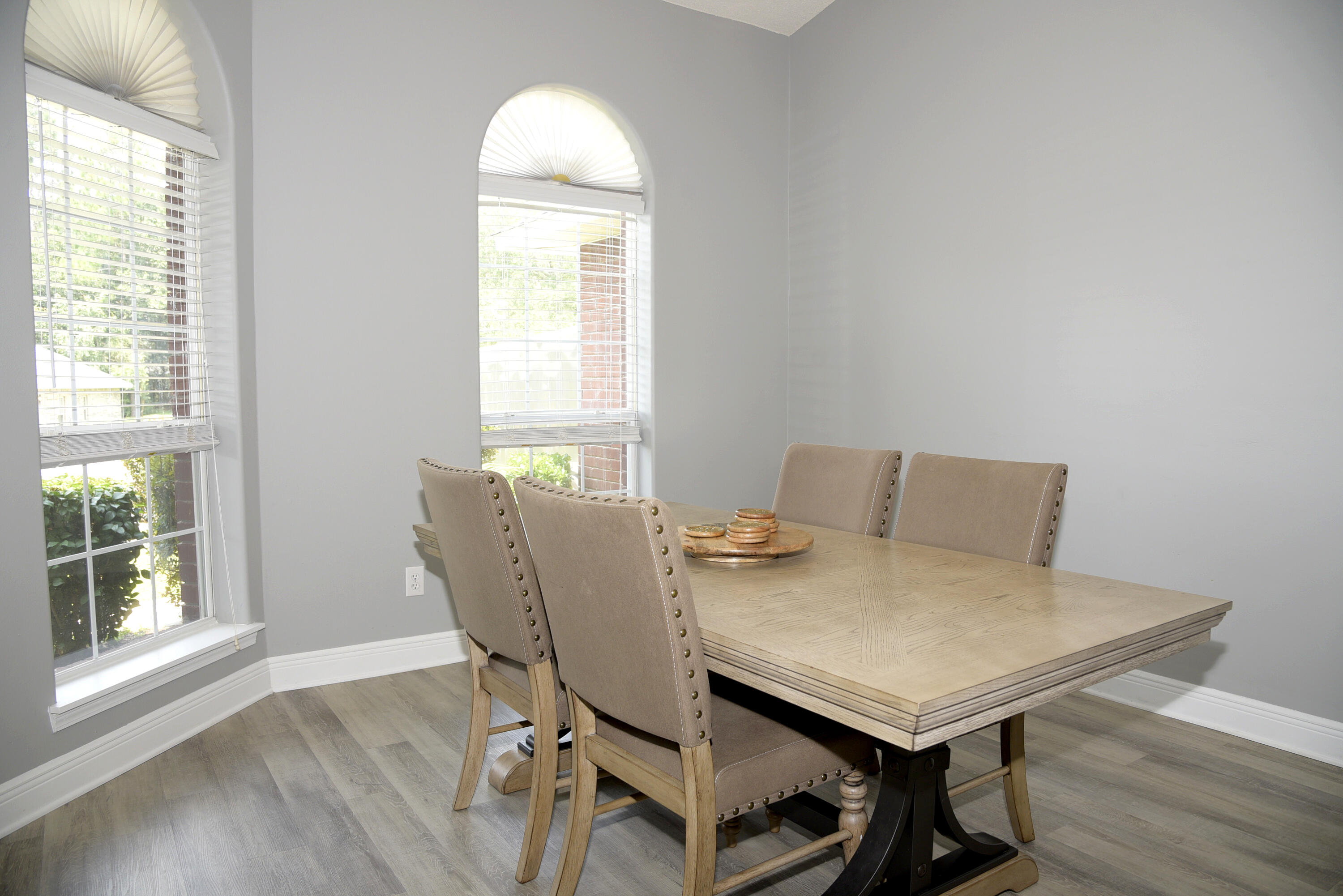 658 Territory Lane Crestview, FL 32536 - Photo 9 of 40 a view of a dining room with furniture and wooden floor