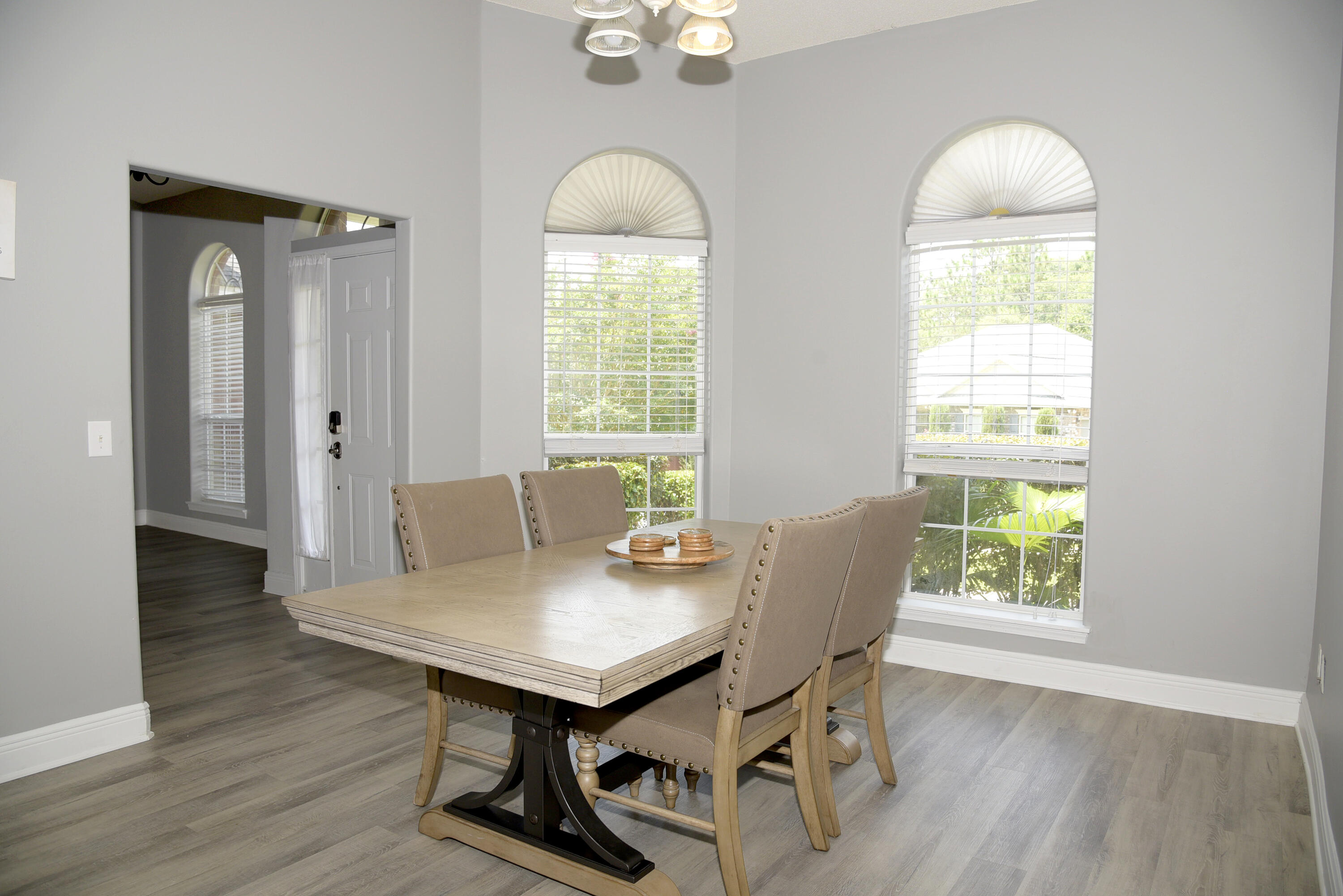 658 Territory Lane Crestview, FL 32536 - Photo 10 of 40 a view of a dining room with furniture and wooden floor