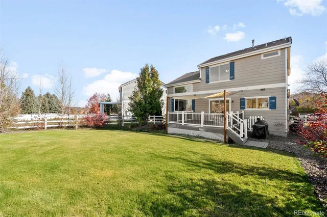 a view of a house with swimming pool and porch