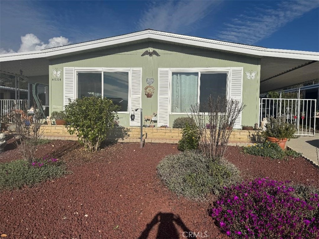 41004 Cheyenne Trail Cherry Valley, CA 92223 - Photo 1 of 10 a front view of a house with a yard