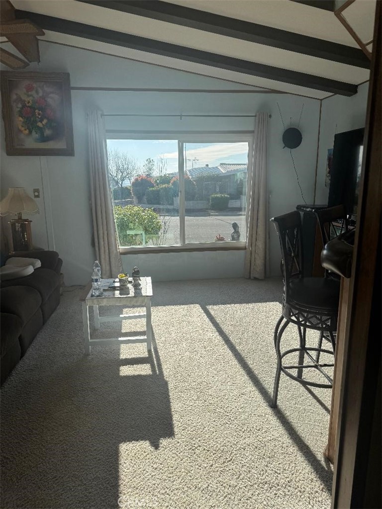 41004 Cheyenne Trail Cherry Valley, CA 92223 - Photo 3 of 10 a living room with furniture and a floor to ceiling window