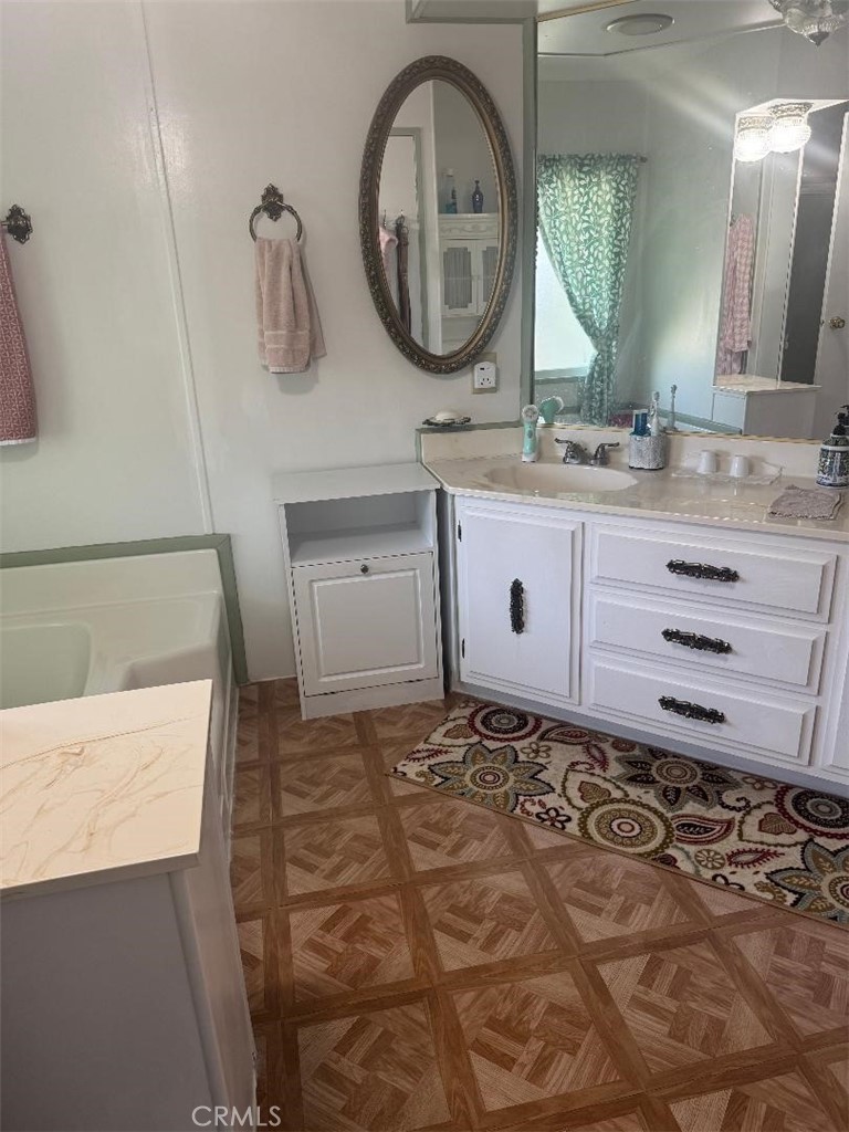 41004 Cheyenne Trail Cherry Valley, CA 92223 - Photo 8 of 10 a bathroom with a sink a toilet and a mirror
