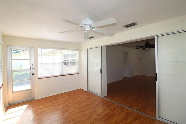 a view of an empty room with a window