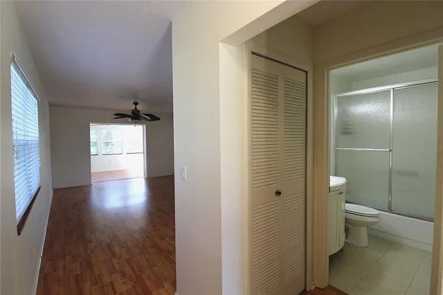 a spacious bathroom with a toilet and a shower