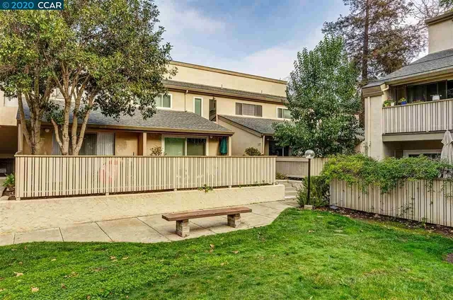 a view of an house with backyard space and garden