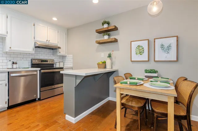 a kitchen with a table and chairs in it