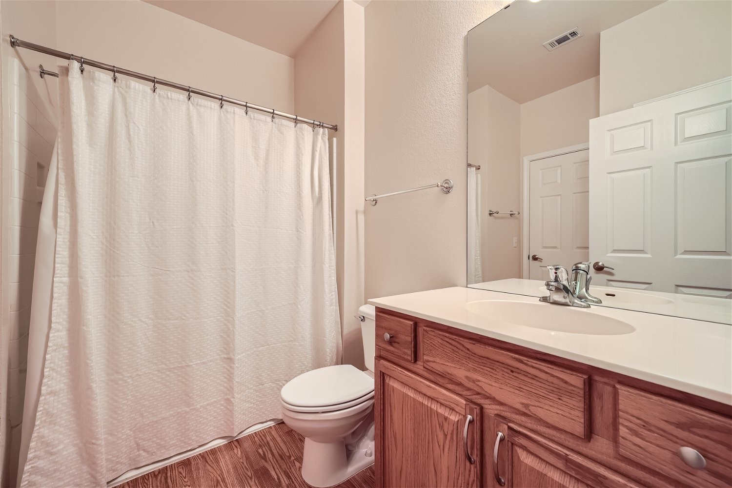 120 Muir Court Georgetown, TX 78633 - Photo 23 of 27 a bathroom with a sink a toilet and shower curtain