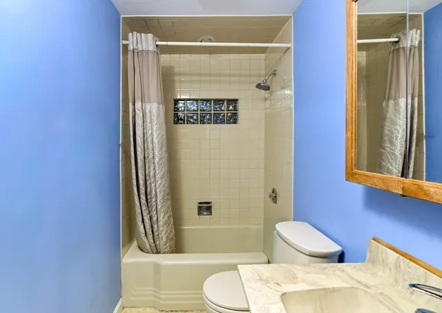 a bathroom with a toilet and a sink