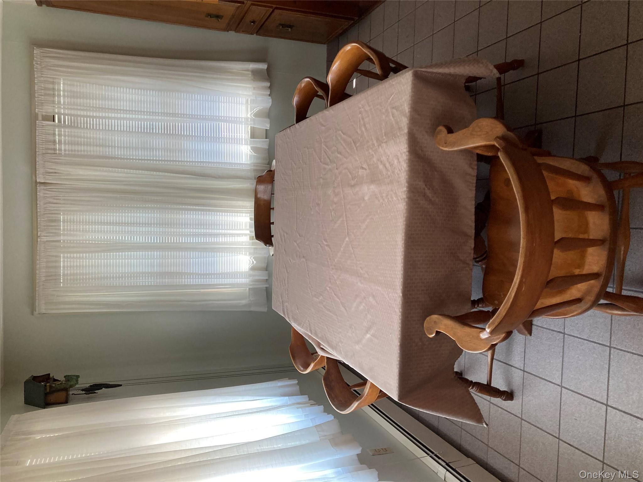 191 Rose Road Woodbourne, NY 12788 - Photo 12 of 32 a room with table chairs and windows