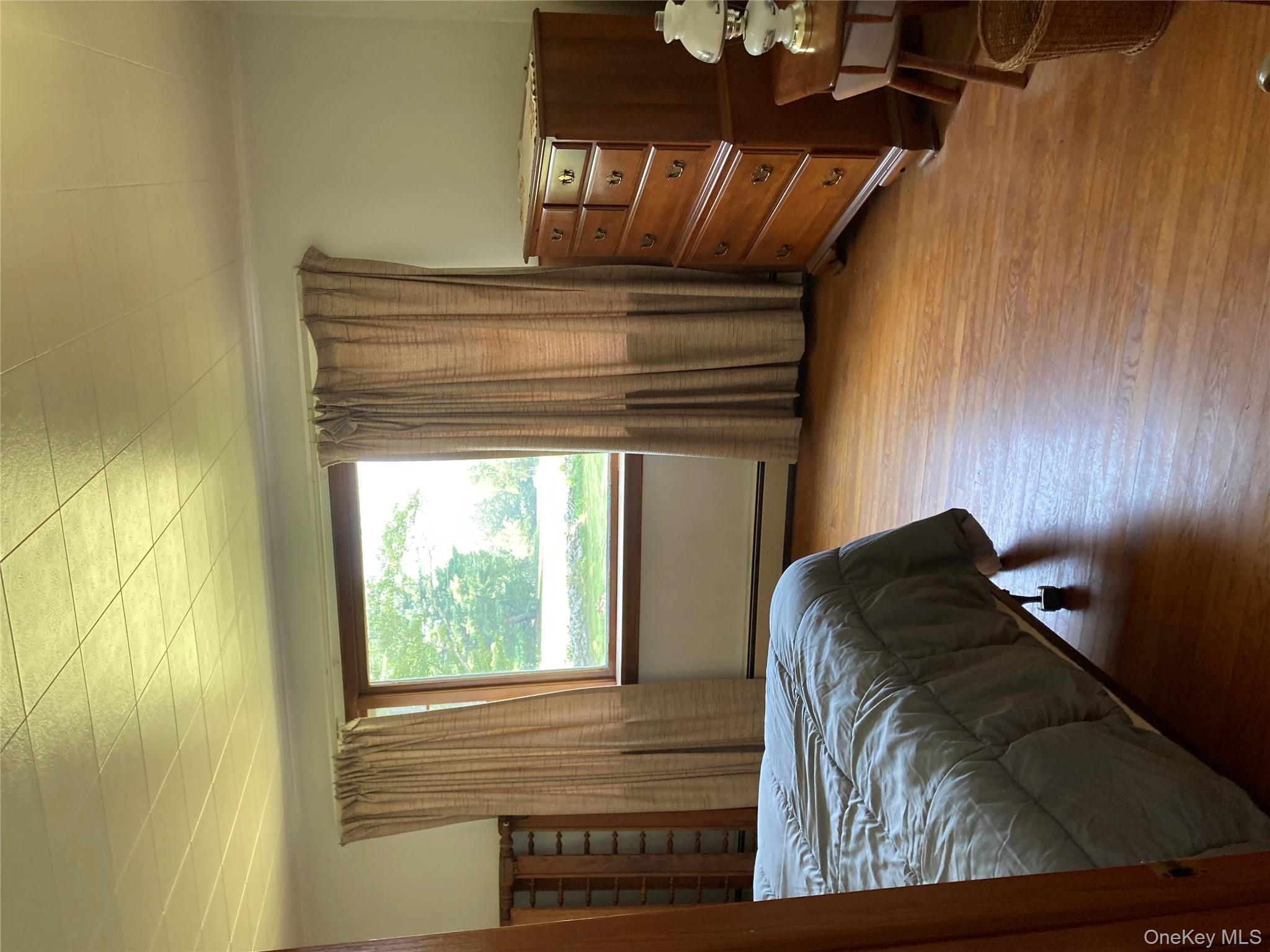 191 Rose Road Woodbourne, NY 12788 - Photo 18 of 32 a bedroom with a bed and a window