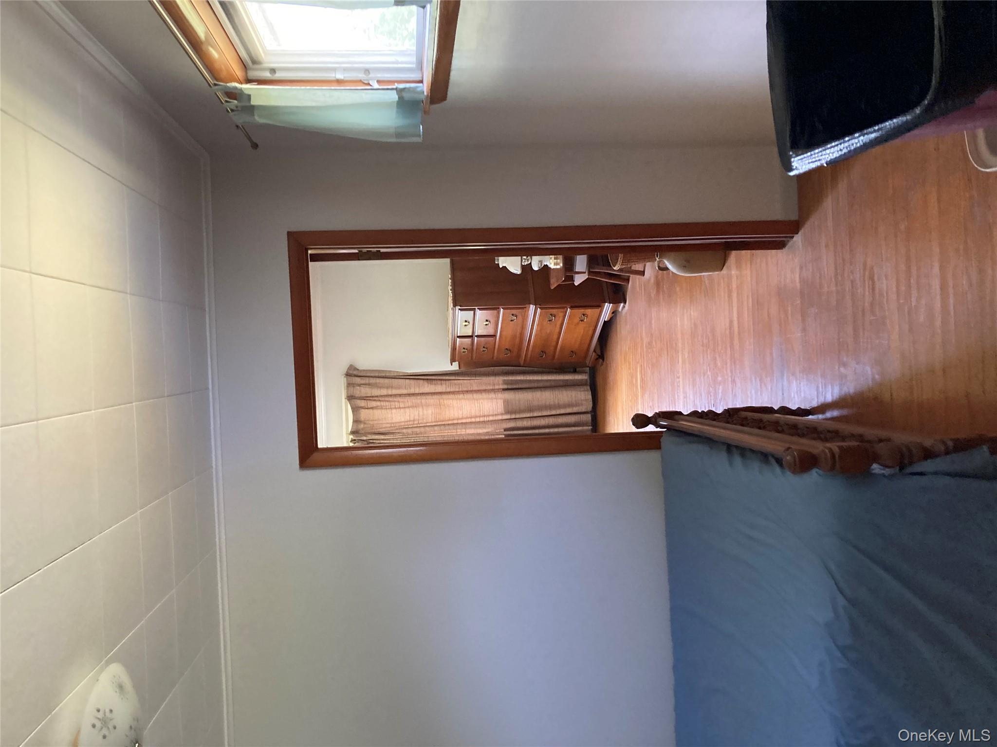191 Rose Road Woodbourne, NY 12788 - Photo 20 of 32 wooden floor in an empty room with a window