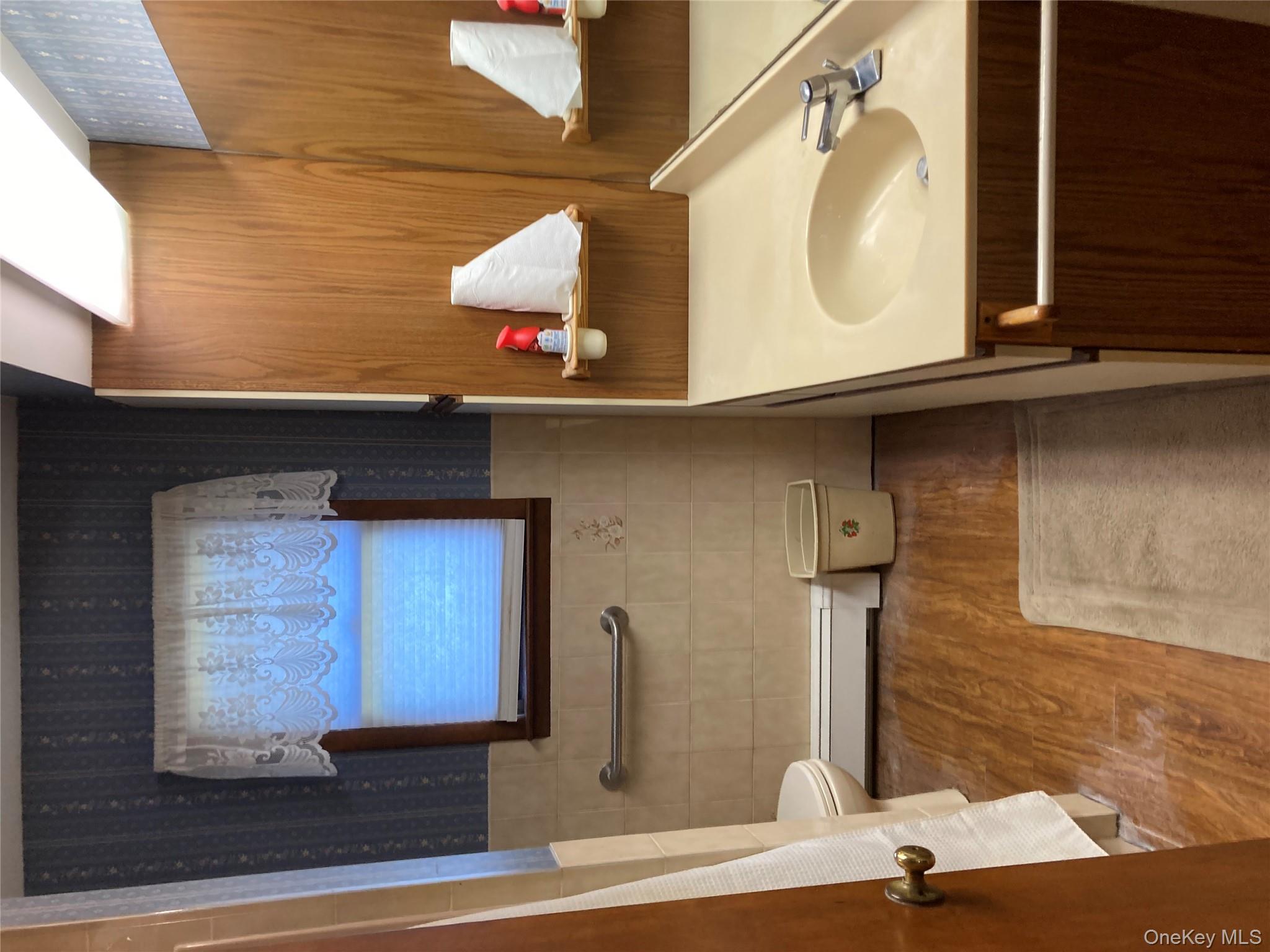 191 Rose Road Woodbourne, NY 12788 - Photo 21 of 32 a bathroom with a sink and a mirror