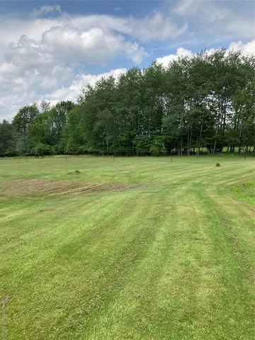 a view of an ocean with a yard