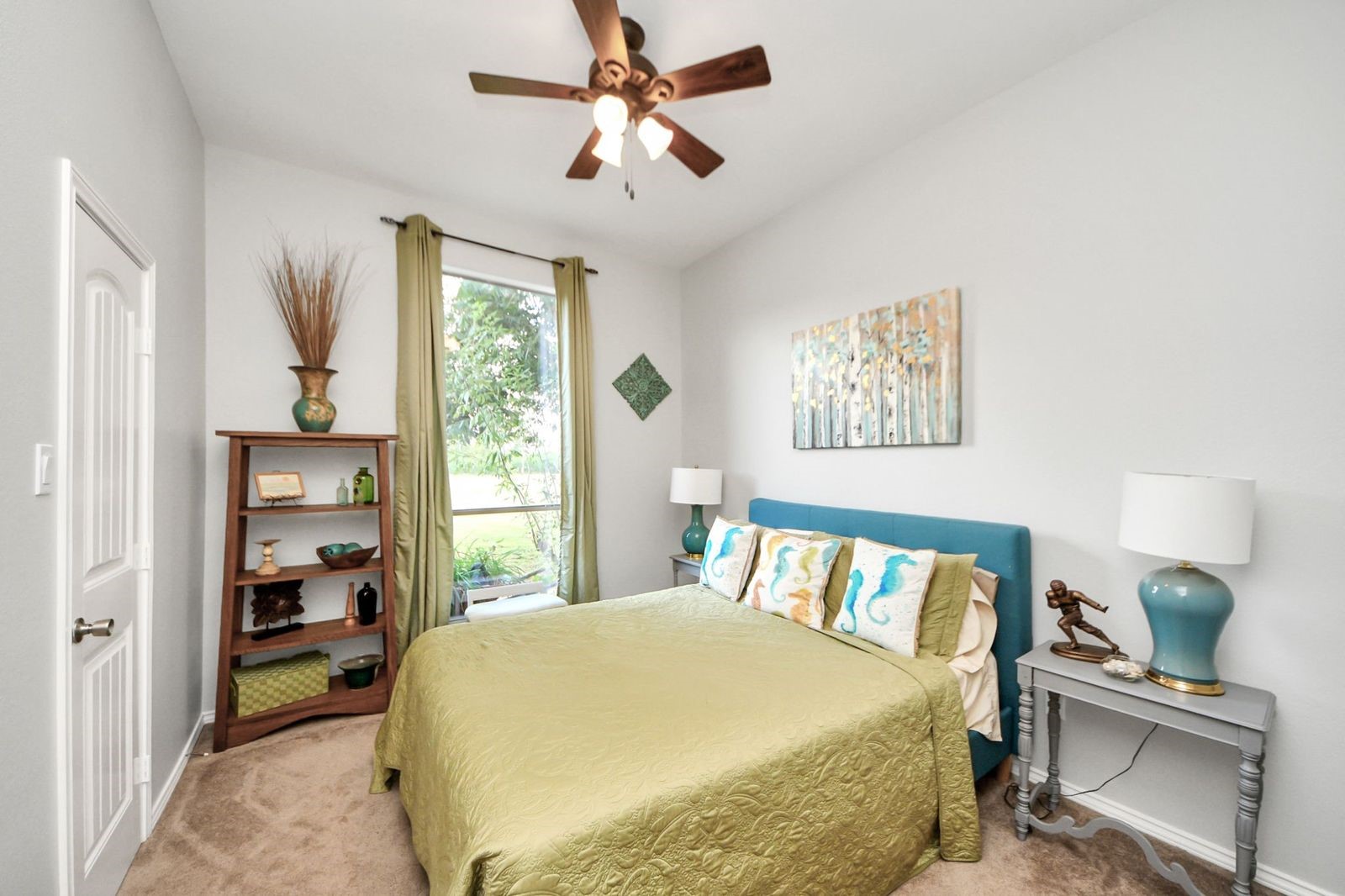 5360 Muske Lane Pattison, TX 77423 - Photo 12 of 44 a bedroom with a bed and a chandelier