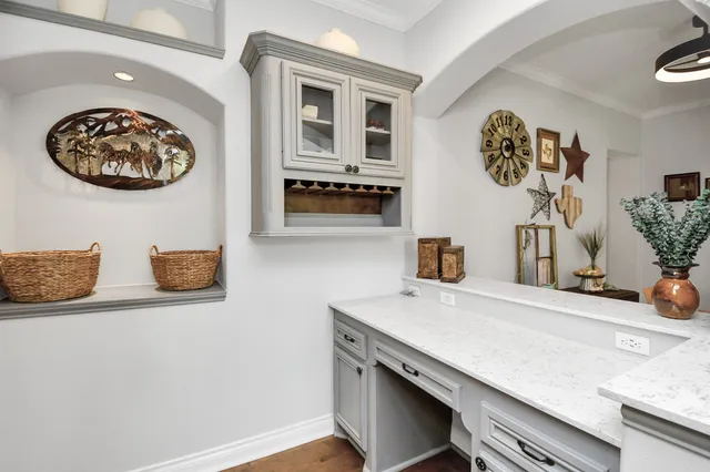 a spacious bedroom with a bed and a flat screen tv