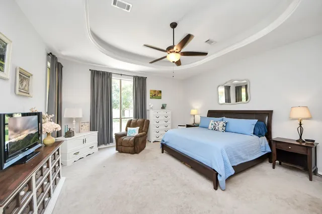 a bedroom with furniture and window