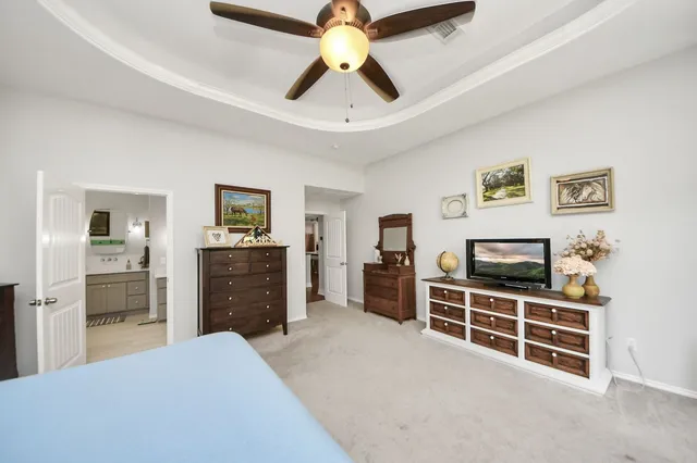 a spacious bathroom with a double vanity sink and a mirror