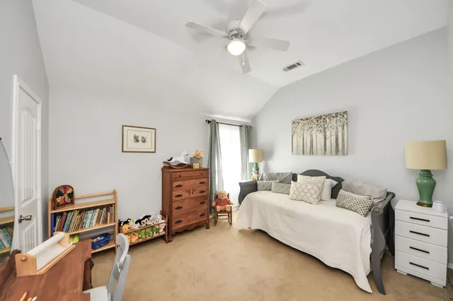 a bathroom with a granite countertop sink a toilet a mirror and shower