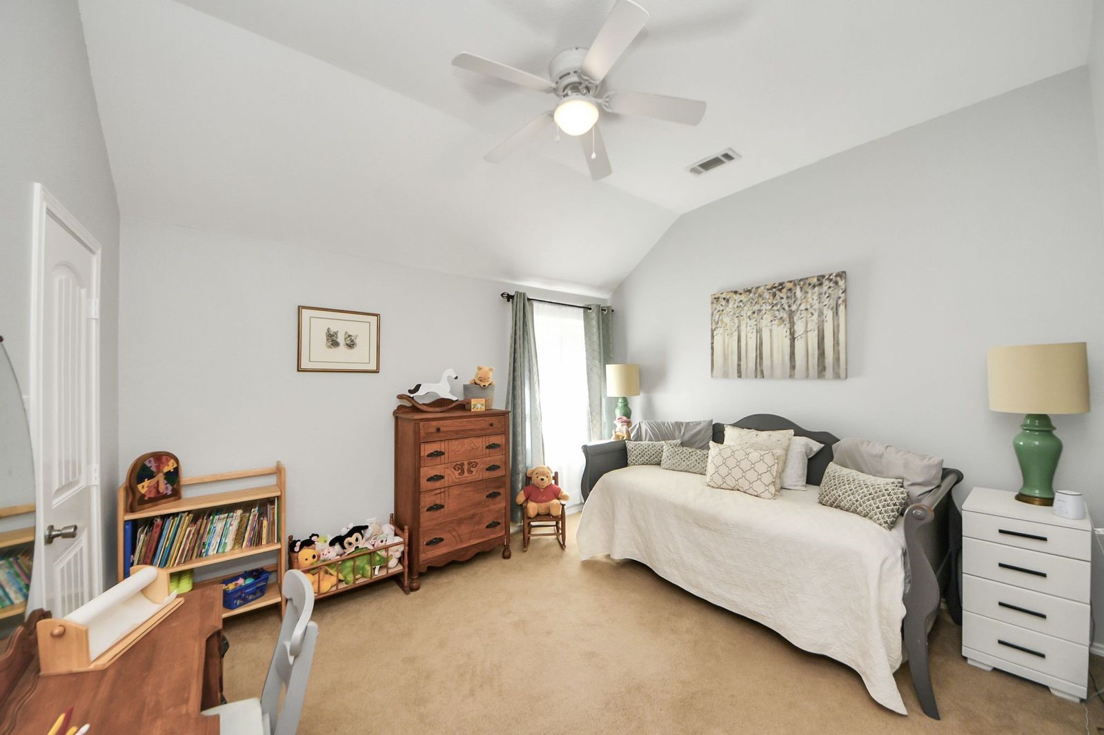 5360 Muske Lane Pattison, TX 77423 - Photo 28 of 44 a bedroom with furniture and a book shelf