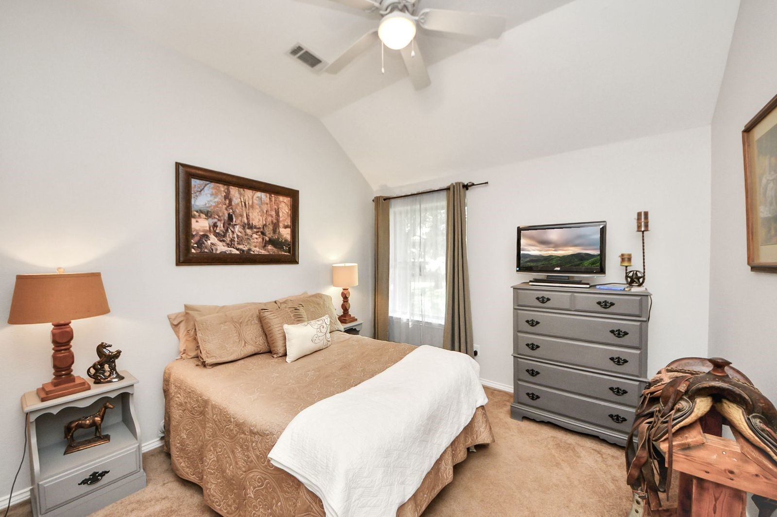 5360 Muske Lane Pattison, TX 77423 - Photo 30 of 44 a bedroom with a bed and a tv