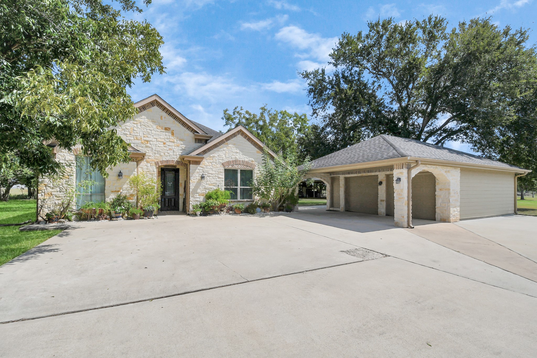 5360 Muske Lane Pattison, TX 77423 - Photo 37 of 44 a front view of a house with yard and garage