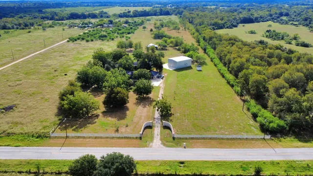 a view of a swimming pool with a yard