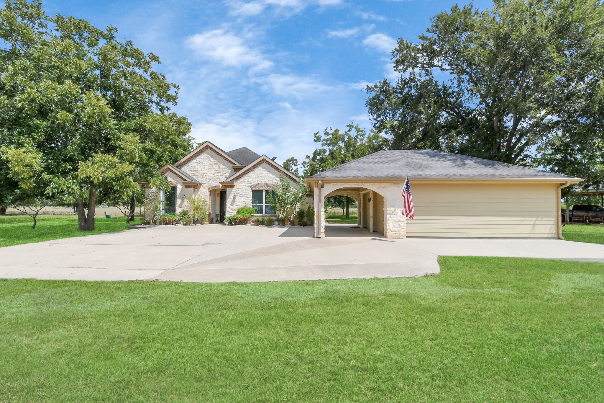 5360 Muske Lane Pattison, TX 77423 - Photo 7 of 44 a front view of a house with a yard and garage