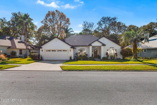 a house with swimming pool in front of it