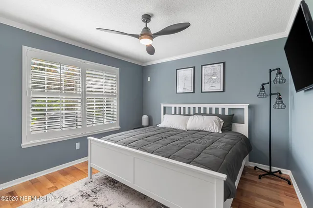 a living room with a bed furniture and a window