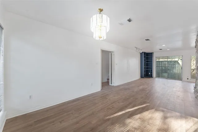 a view of livingroom with kitchen and window