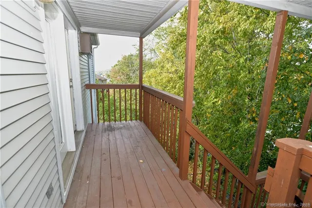 a view of balcony with wooden floor