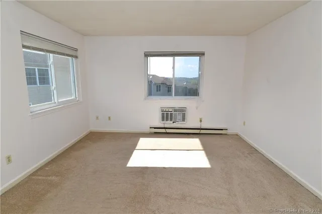 an empty room with a fireplace