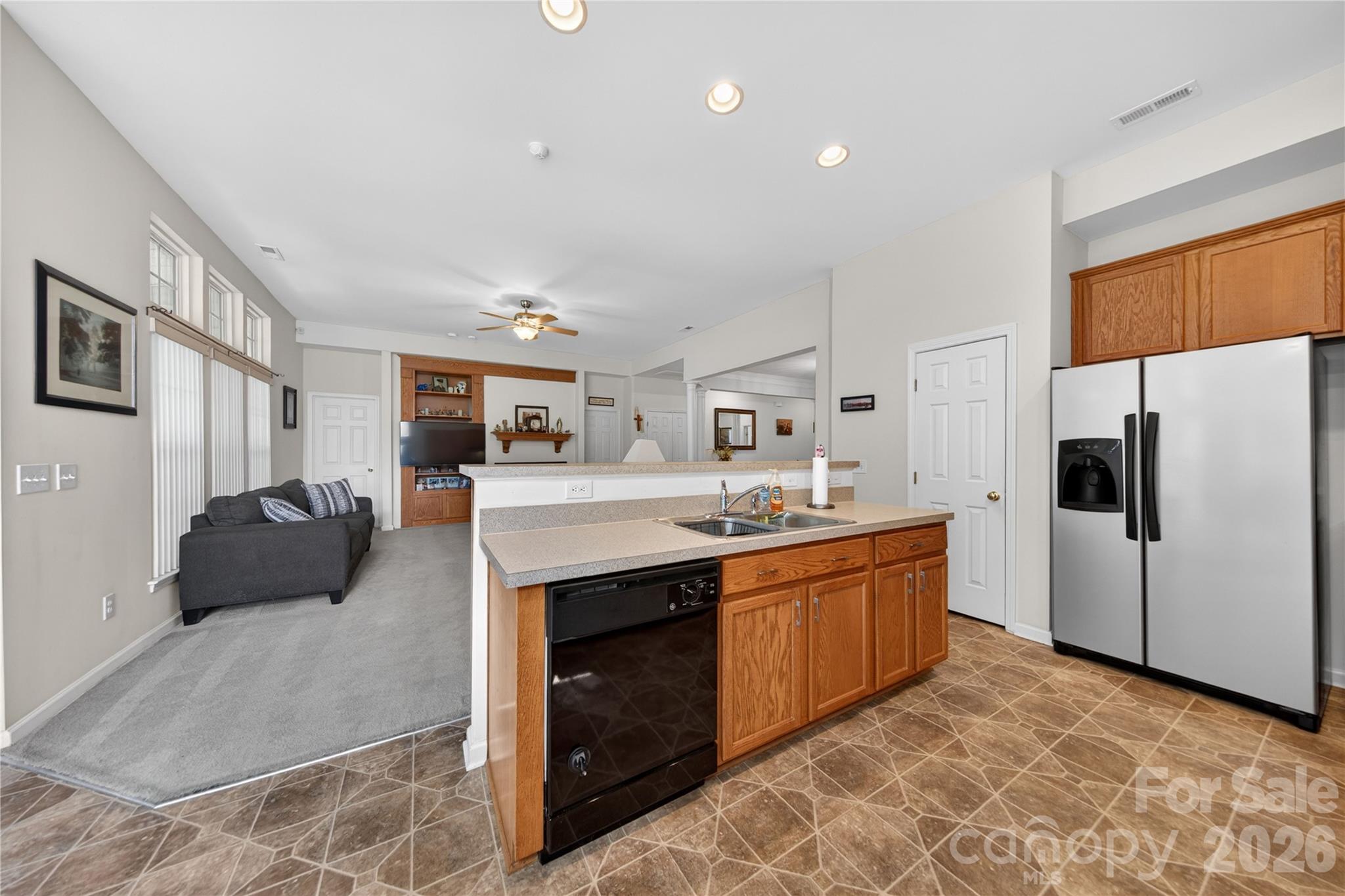 533 Fair Oaks Drive Fort Mill, SC 29708 - Photo 12 of 33 a large white kitchen with stainless steel appliances granite countertop a stove and a refrigerator